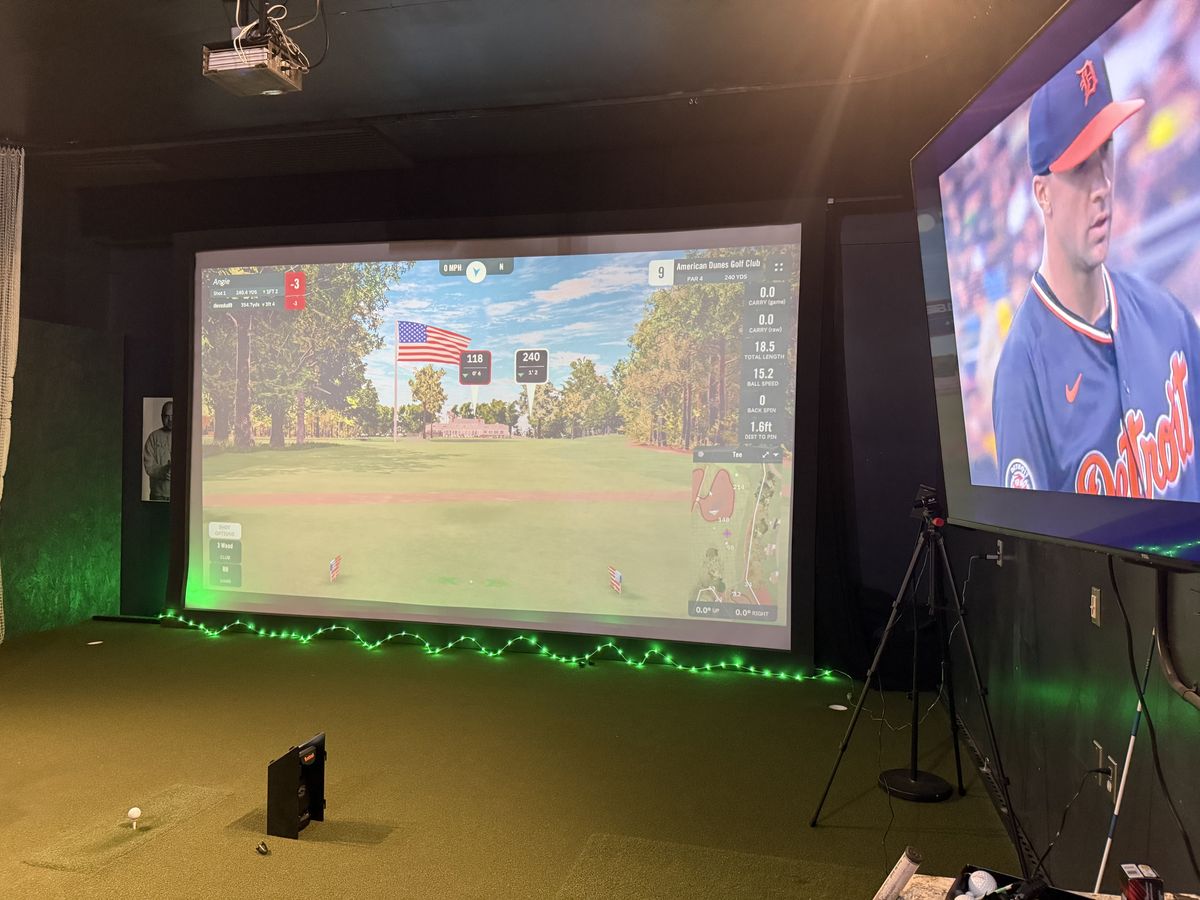 The whole bay: the big screen with green LED glow along its base